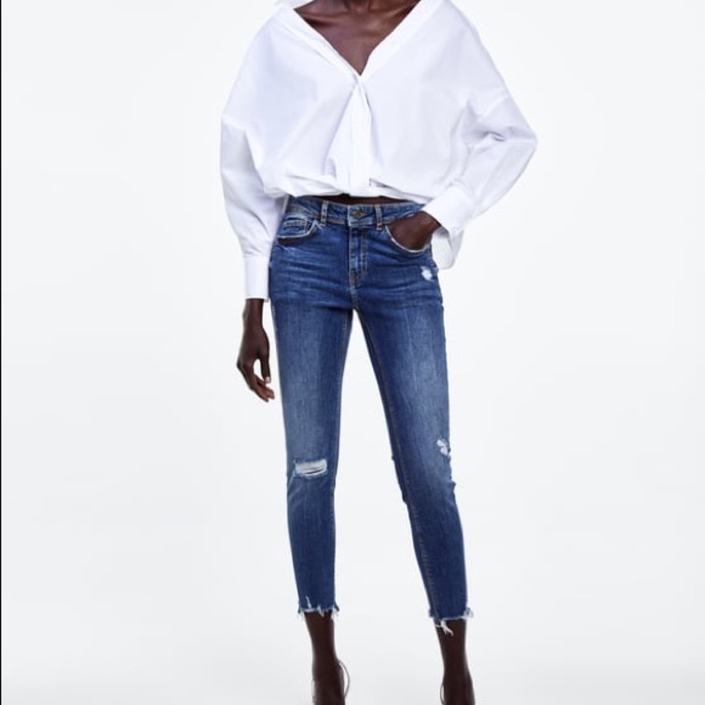 Zara Mid Wash distressed denim with raw hem